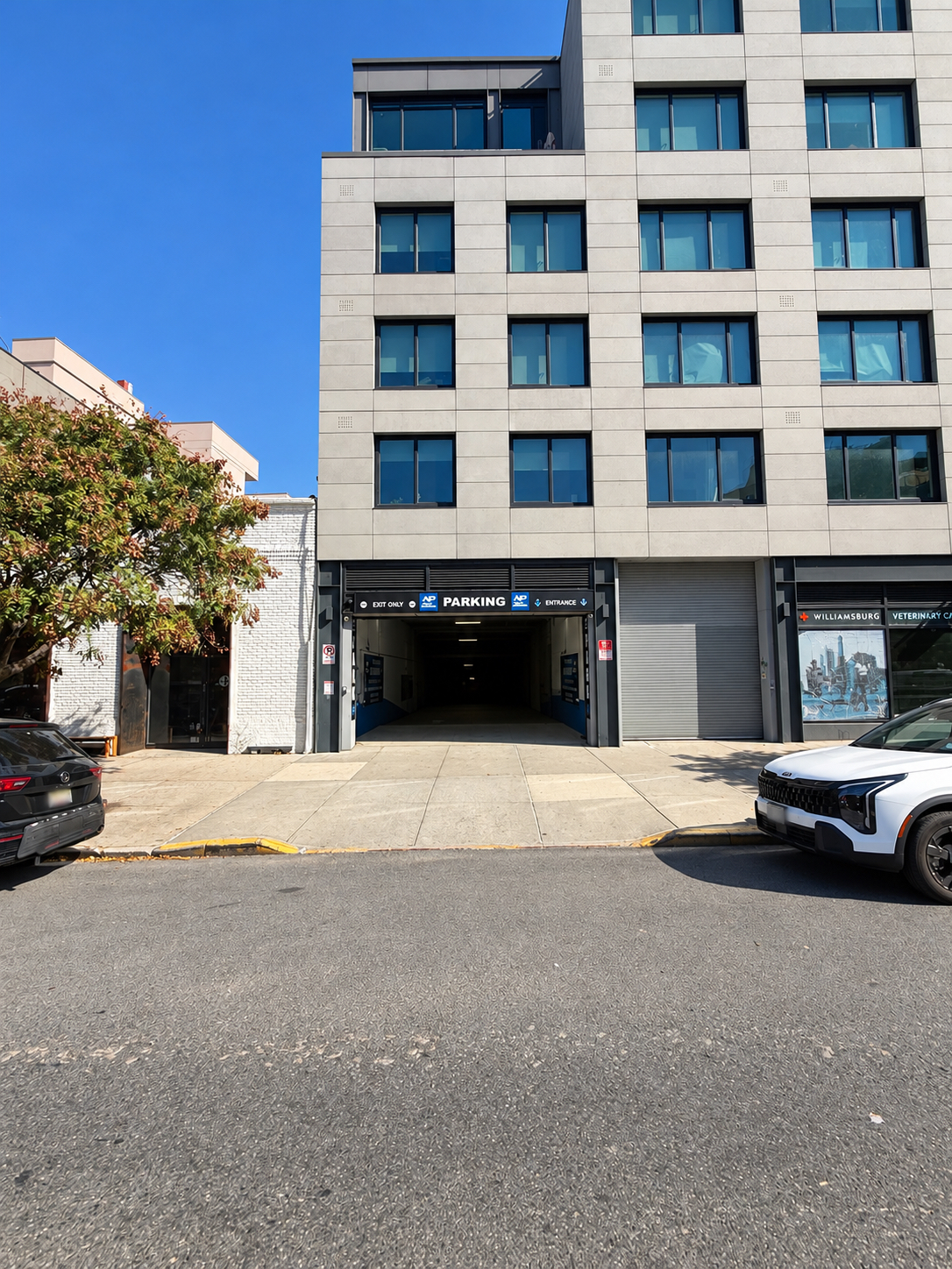 Building exterior and garage entrance at 125 Metropolitan Avenue