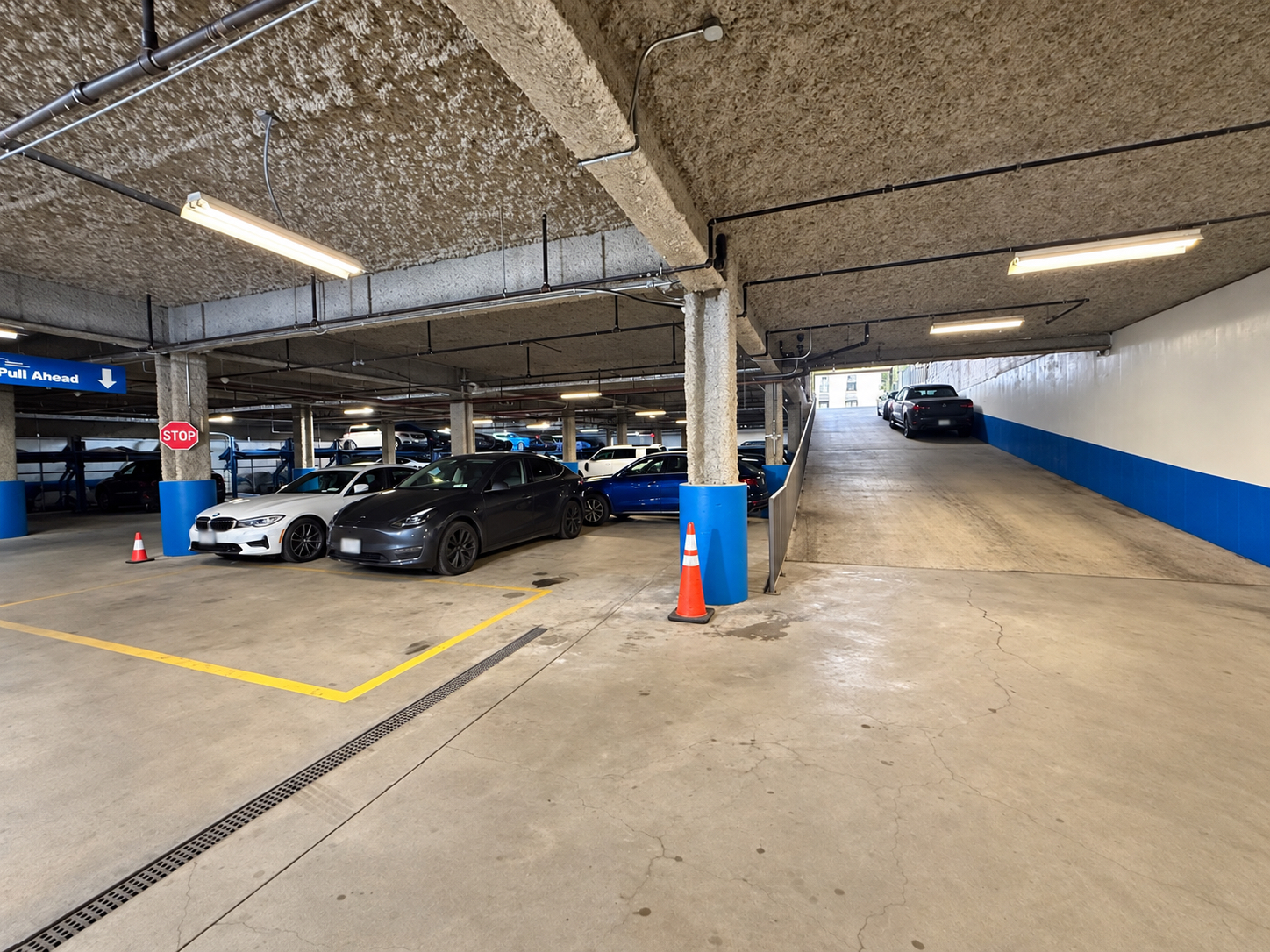 Interior parking area beside the ramp to street level at 125 Metropolitan Avenue