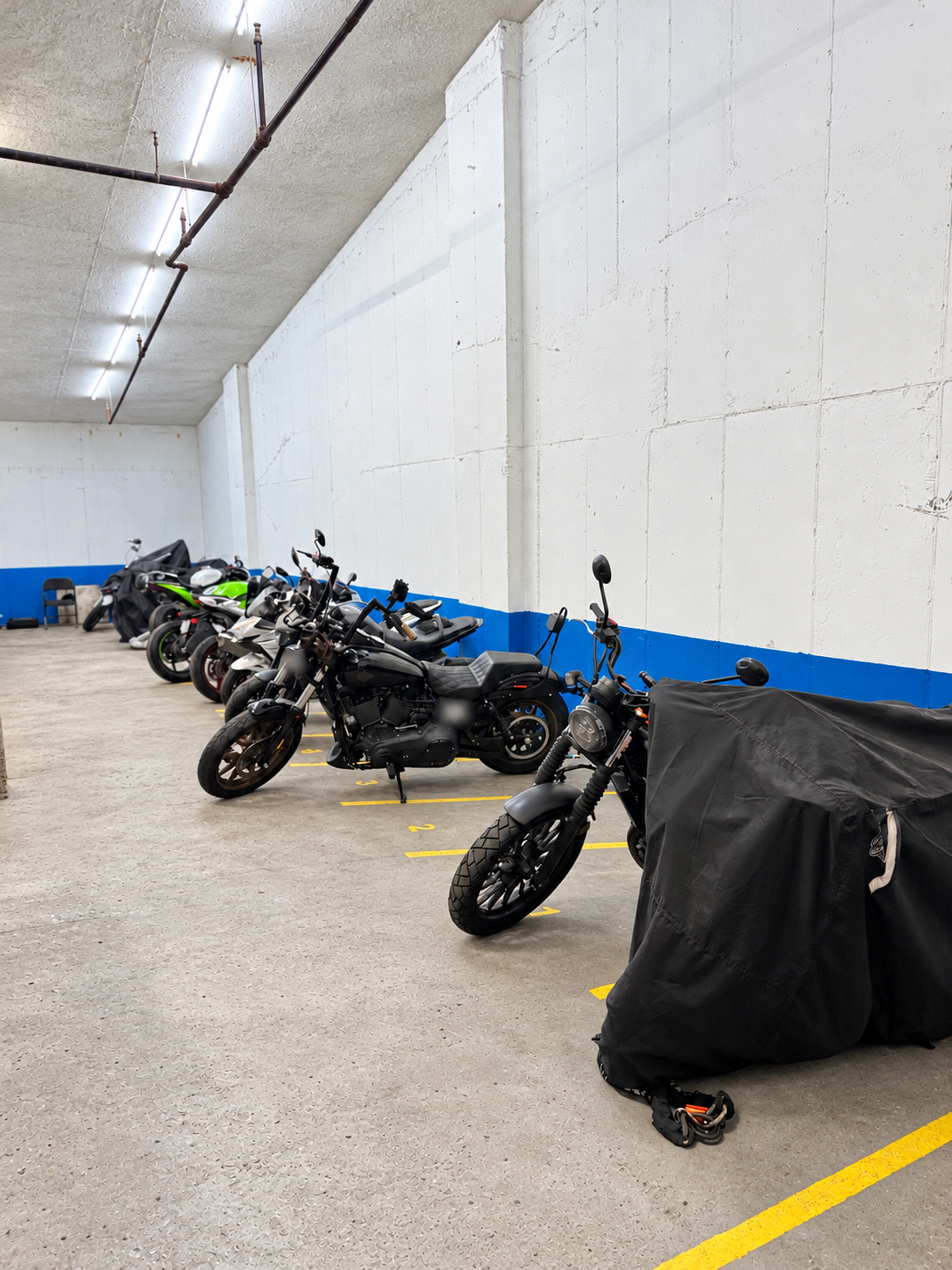 Motorcycle parking spaces inside the garage at 222 Johnson Avenue